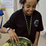 Lucy gets spinach ready