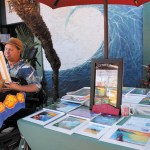 Moses Hamilton sets up his booth at Ching Young Village. Coco Zickos photo